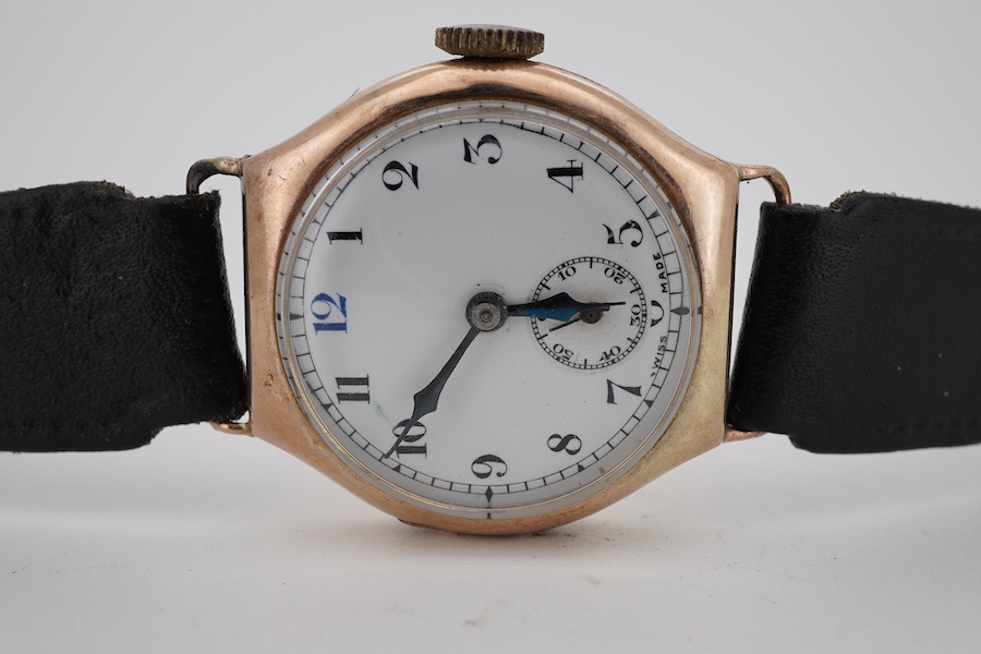 A gentleman's late 1920's 9ct gold Visible manual wind wrist watch, with Arabic dial and subsidiary seconds, case diameter 29mm, on a later associated leather strap.